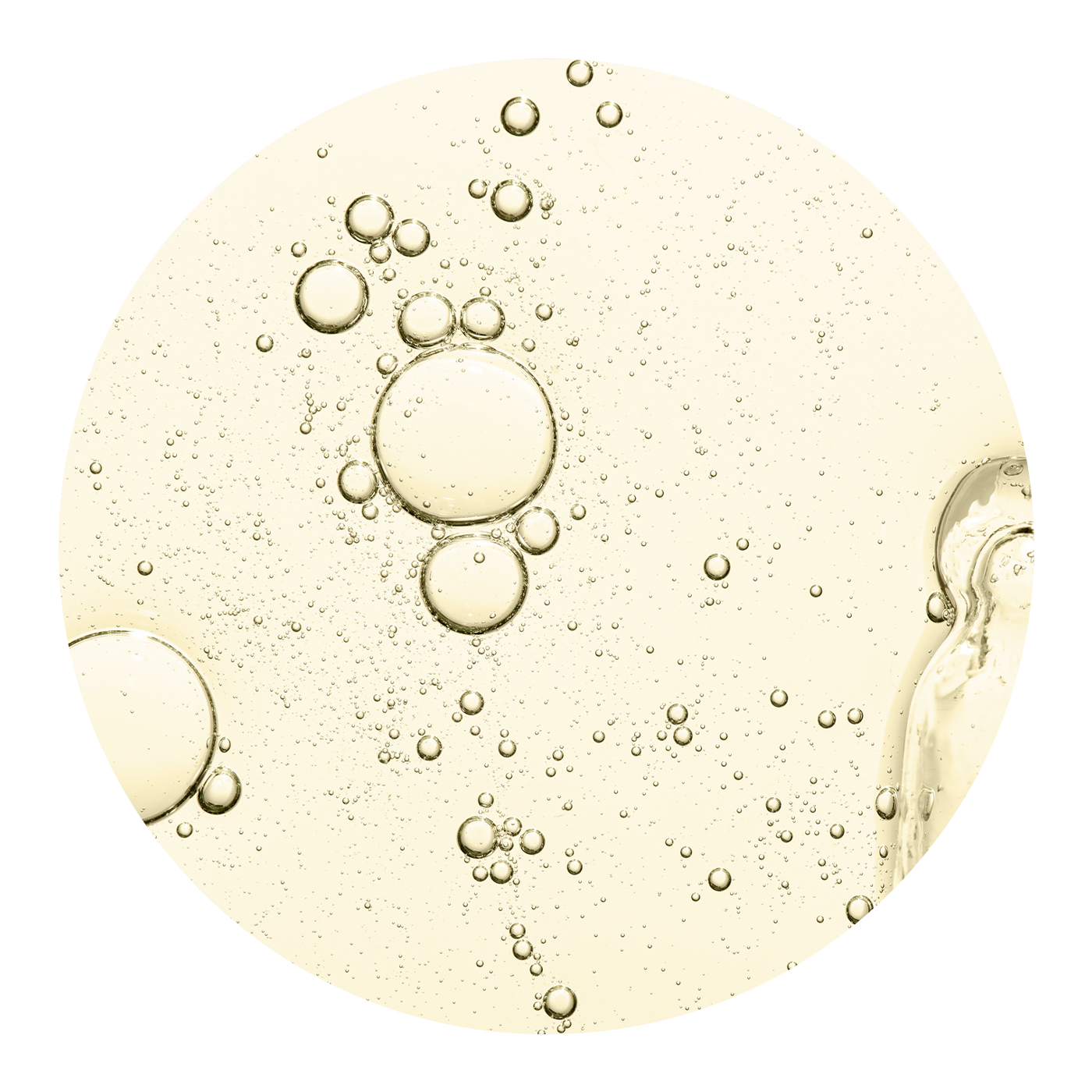 Close up of yellow oil with bubbles in it